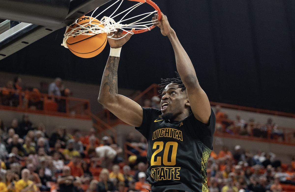 Wichita State’s Emmanuel Okorafor dunks the ball during the second half of their NIT second round game against Oklahoma State.