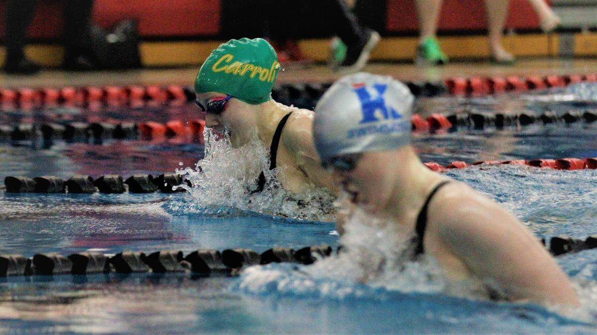 Kapaun’s Claire Conover (right) is on The Wichita Eagle’s 2021 All-Metro girls swimming and diving team.