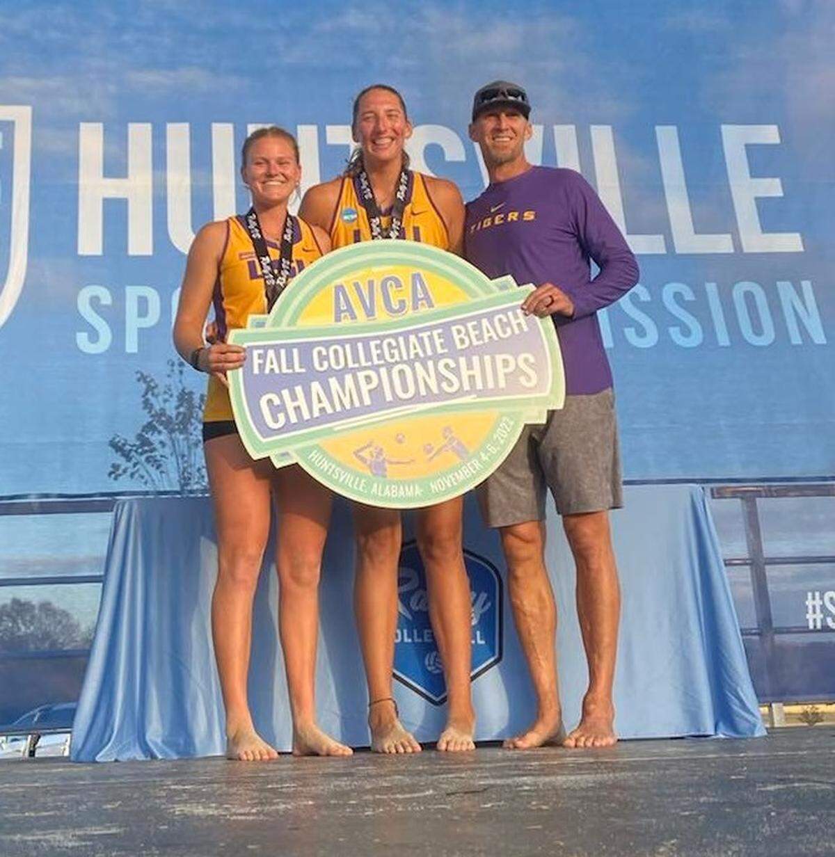 Valley Center native Ellie Shank (left) poses with her LSU women’s beach volleyball teammate Kylie Deberg (middle) after the duo won the AVCA Pairs National Championship.