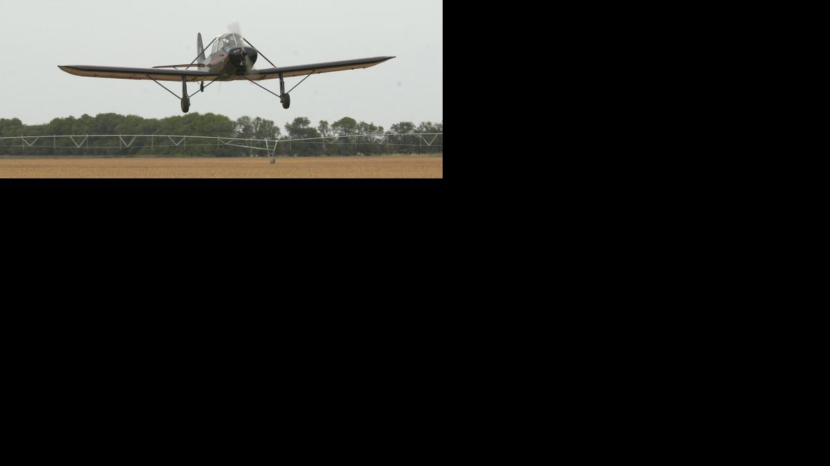 Wesley Kimball prepares to land a Rawdon T-1 on a runway near Clearwater in 2002. The Kansas Aviation Museum plans to move the vintage plane Wednesday from Yingling Aviation at Wichita Mid-Continent Airport to the museum in southeast Wichita.

