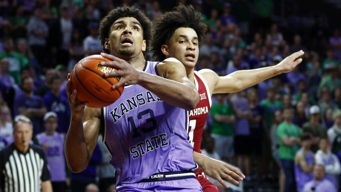 Kansas State guard Mark Smith (13) attempts to score against Oklahoma forward Jalen Hill, right, during an NCAA college basketball game on Saturday, March 5, 2022 in Manhattan, Kan. (AP Photo/Colin E. Braley)