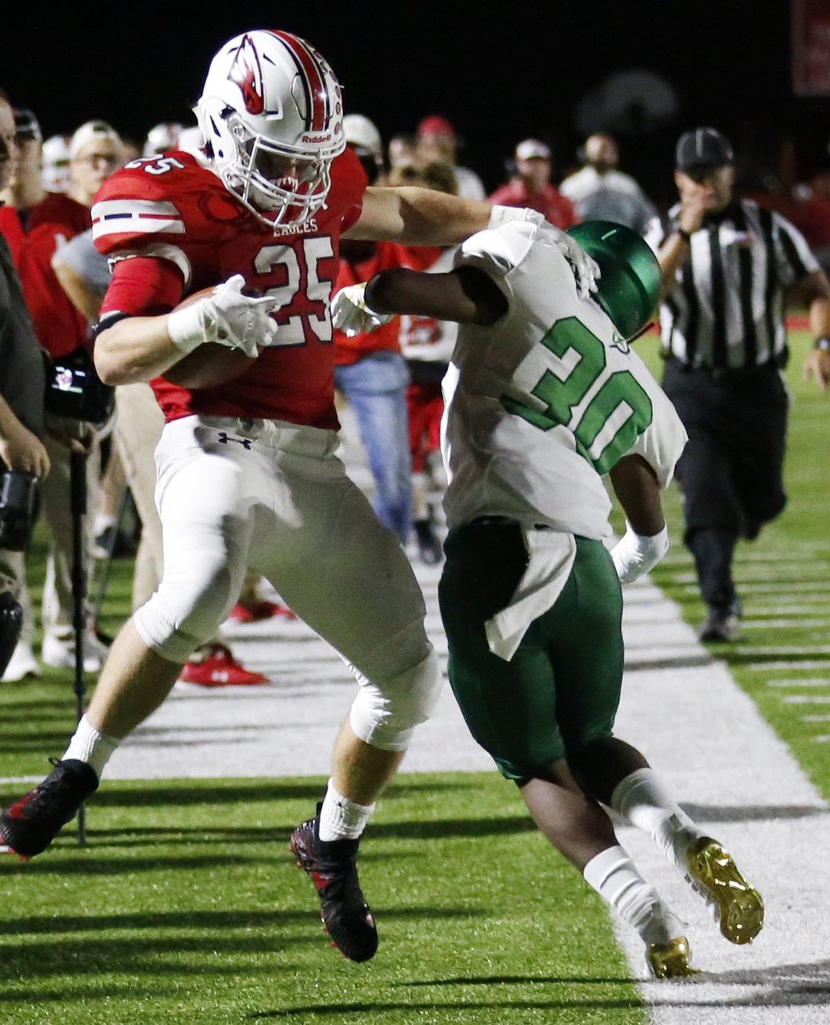 Maize running back #25 Caden Cox is hit late by Derby defender # 30 Terry Ginyard.  Derby was penalized for the hit Friday night in Maize. (October 19, 2018)