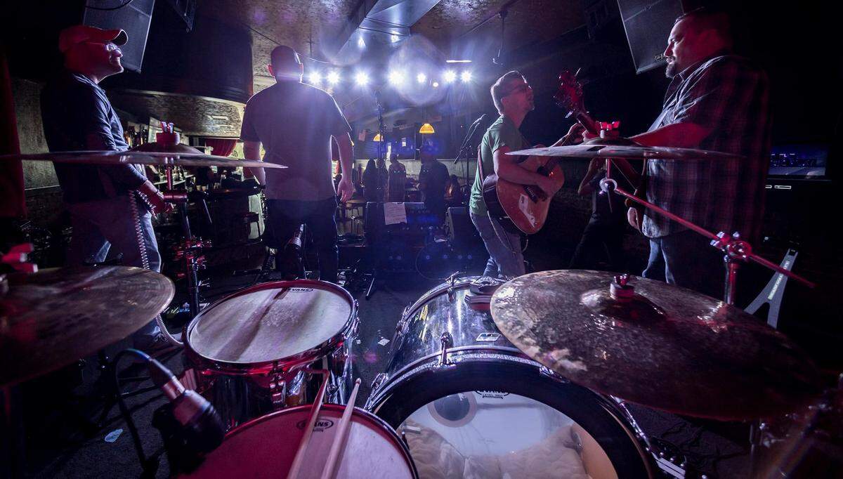 The band Sometimes on Sunday warm up for a performance at Barleycorn’s in downtown Wichita in October of 2021. From left: Matt Creasman, Jon Albers, Toby Tyner and Chad Cushenbery.