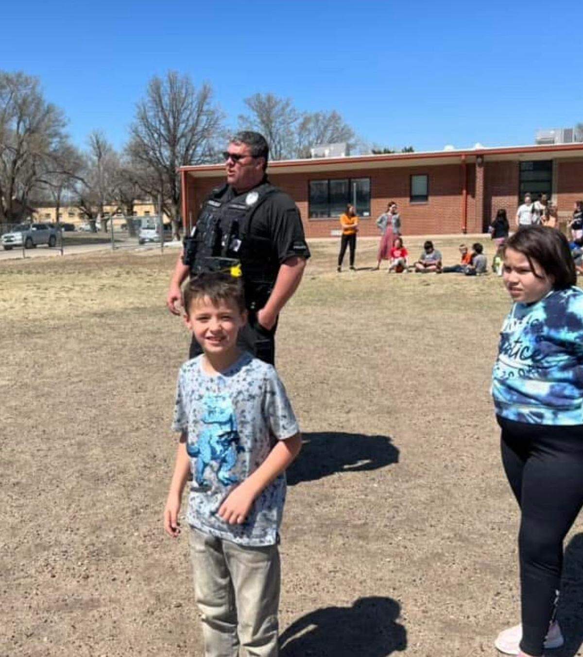 Park Elementary Student Resource Officer Paul Millard hangs out with students during recess.