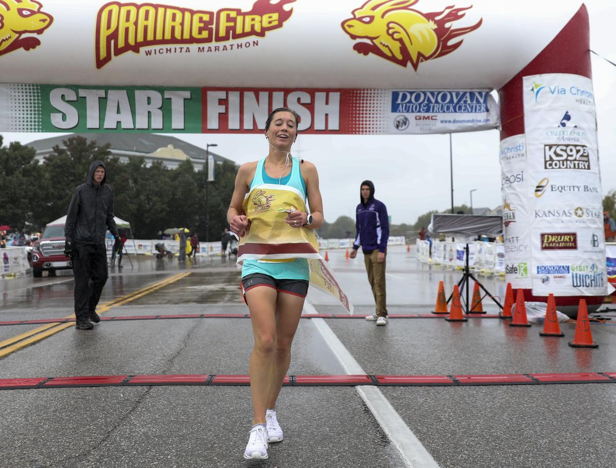 Women’s Prairie Fire Marathon winner Jamie O’Hara crosses the finish line with a time of 3:14:09.