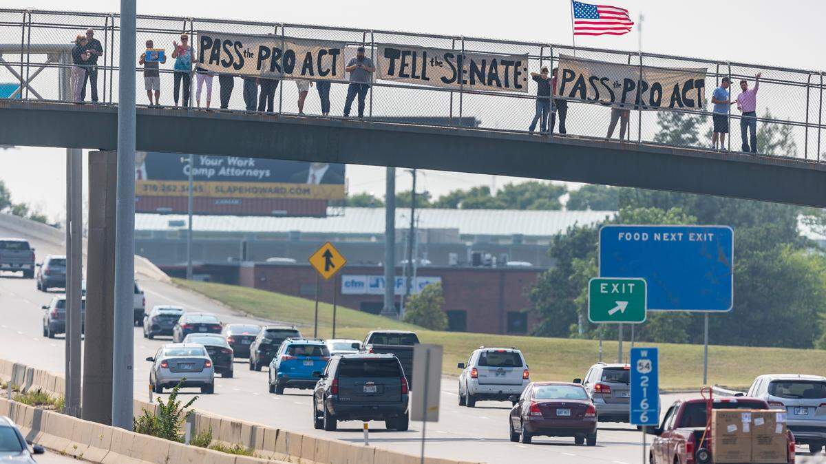 Labor activists with the Kansas AFL-CIO and the Wichita/Hutchinson Labor Federation rallied over Kellogg during rush hour in support of the Protecting the Right to Organize (PRO) Act, a comprehensive labor law reform bill currently before the U.S. Senate.