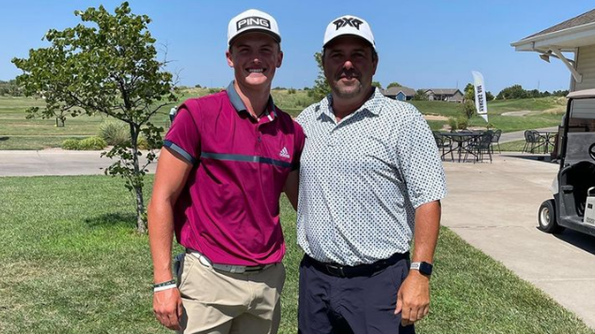Asher Whitaker, a 17-year-old high school junior at Kapaun Mt. Carmel, advanced to the 36-hole final in the Kansas Amateur Match Play championship at Sand Creek Station on Sunday. He is pictured on the left with his caddy Eric Johnsen on the right.