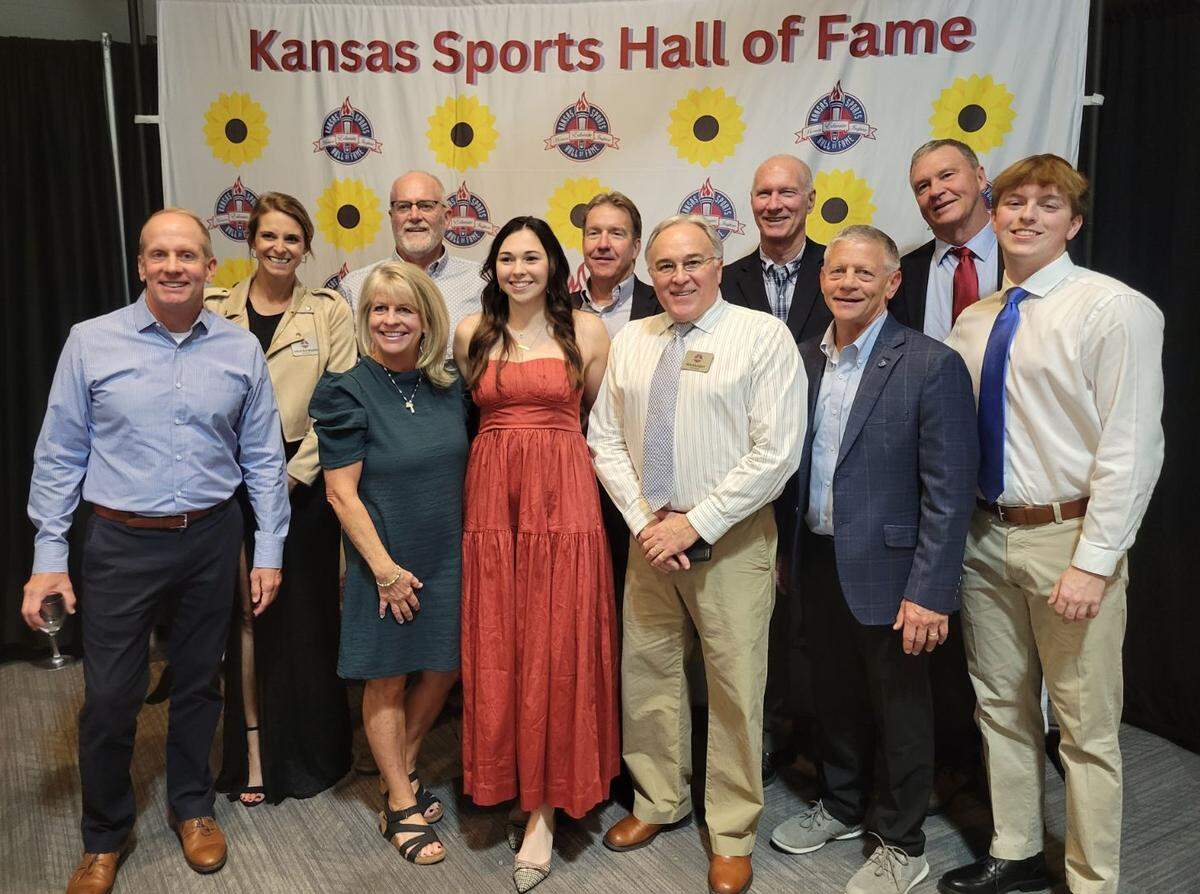 Wichita native Ron Neugent (light blue tie) was recently honored by being inducted to the Kansas Sports Hall of Fame for his decorated career in swimming.