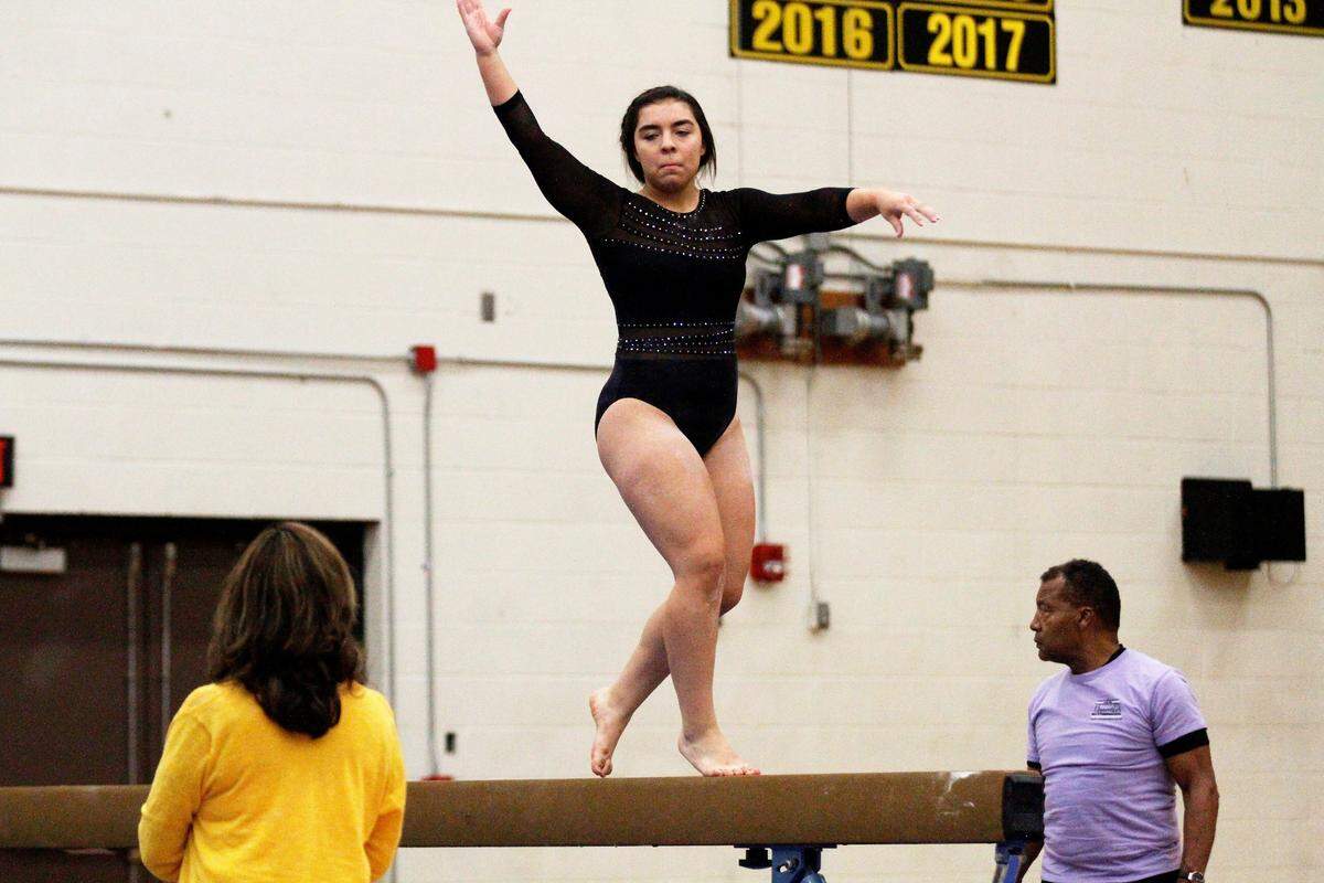 Newton sophomore Toria Thaw on the balance beam during the Railers’ home meet against Emporia on Monday. (Oct. 8, 2018)