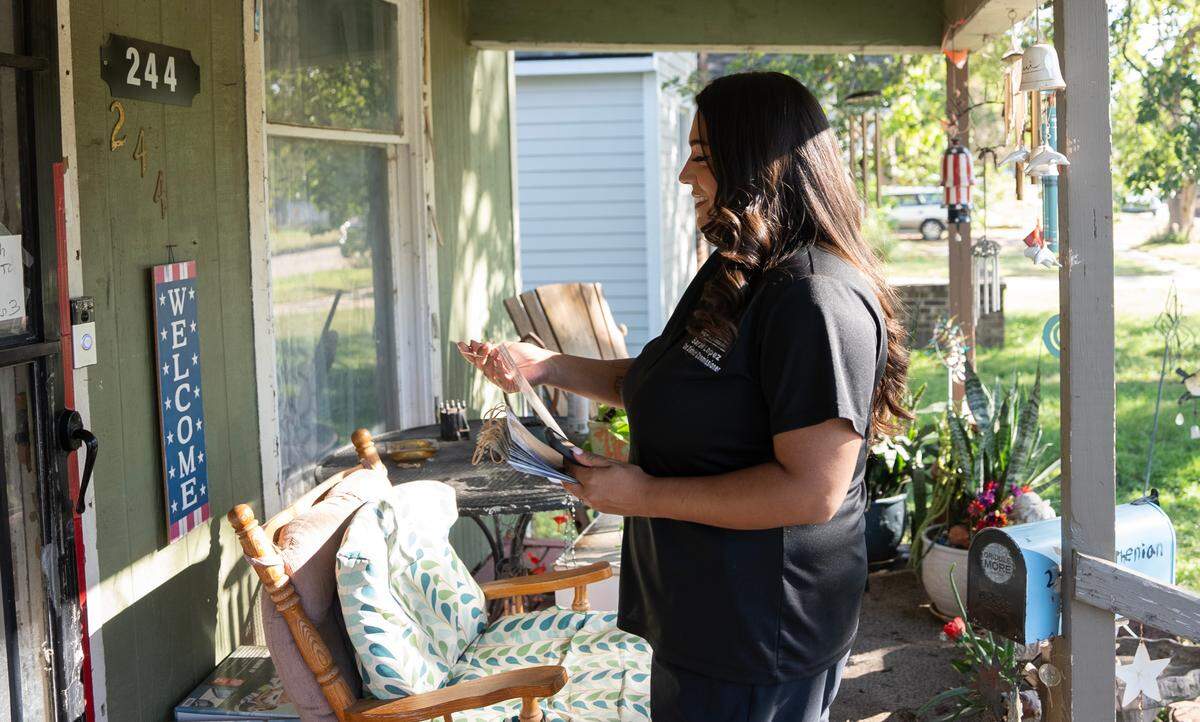 Democrat Sarah Lopez knocks on doors in the Delano neighborhood. Lopez is running for reelection to the Sedgwick County Commission in District 2. She was elected to the commission in 2020.
