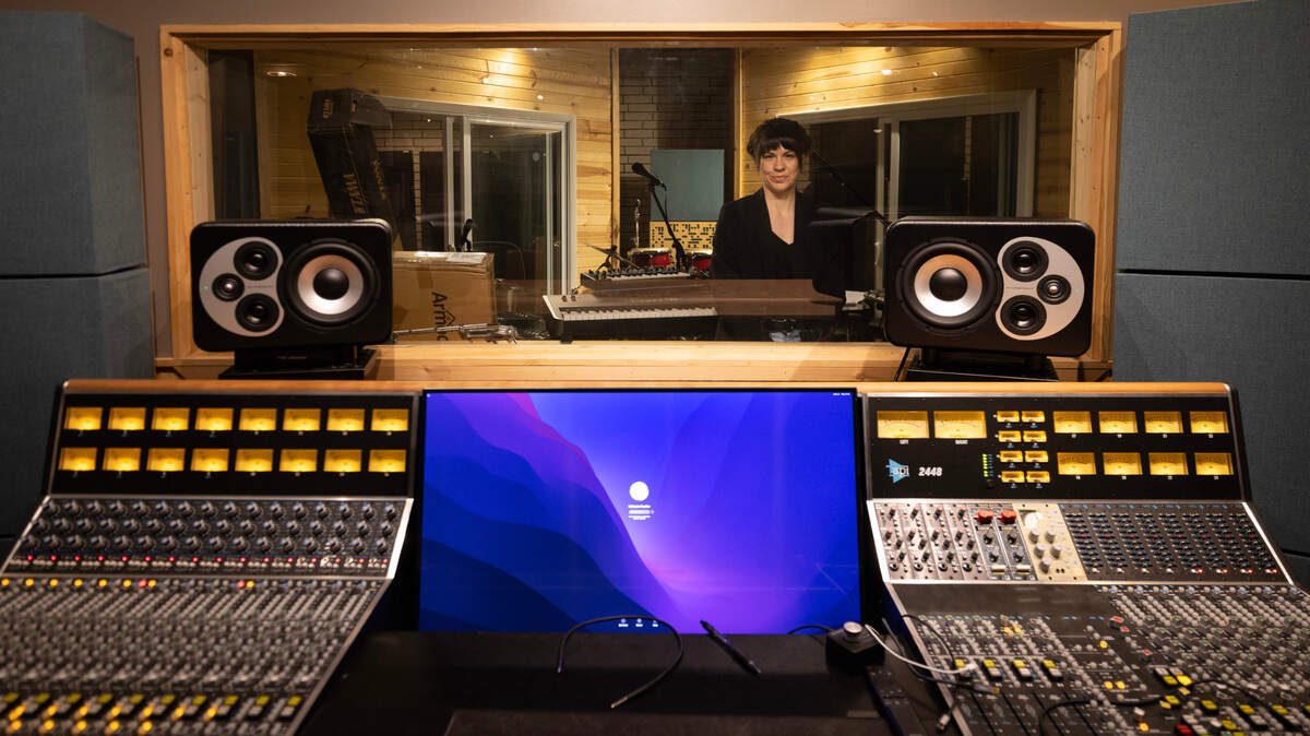 Jessie Hartke, pictured, along with her husband, Adam, have started a nonprofit called Midtopia to help musicians turn their art into profitable full-time careers. Part of that help comes in the form of a new recording studio.
