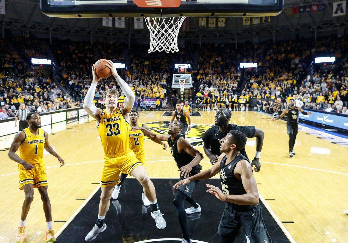 Wichita State center Asbjorn Midtgaard goes to the basket again UCF during the second half of their game at Koch Arena on Wednesday.