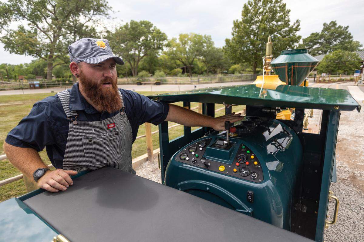 Riley Schwartz prepares to operate the Sedgwick County Zoo’s new Martha C. Buford Safari Express Train on Thursday. The new attraction opens to the public on Friday.
