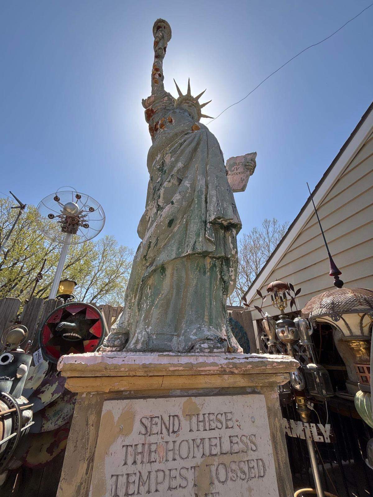 A 20-foot-tall replica of the Statue of Liberty is among the items from Steampunk Village that are up for auction.