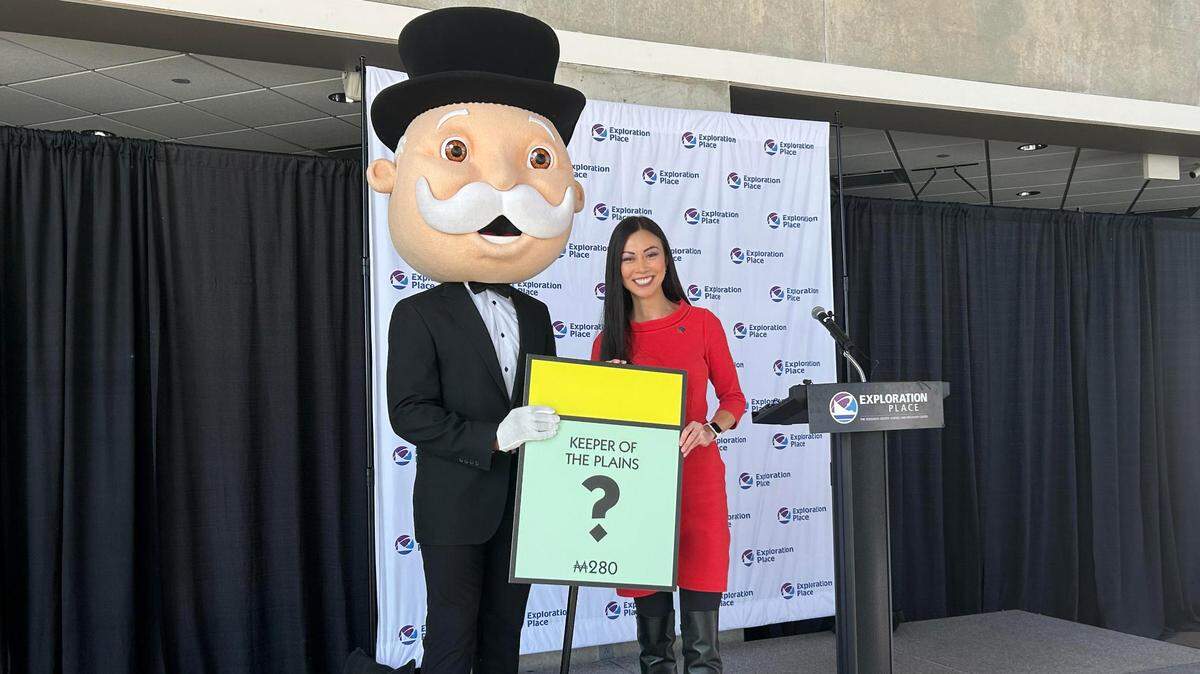 Wichita Mayor Lily Wu poses with Mr. Monopoly at the Exploration Place on Wednesday. The toy and game company Top Trumps announced during the Wednesday press conference that a Wichita version of the classic Monopoly game is in the works.
