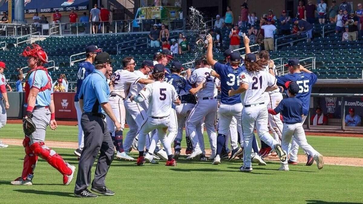 The Wichita Wind Surge celebrate the improbable inside-the-park, walk-off home run by Alex Isola for a 13-12 win over Springfield at Riverfront Stadium on Sunday.