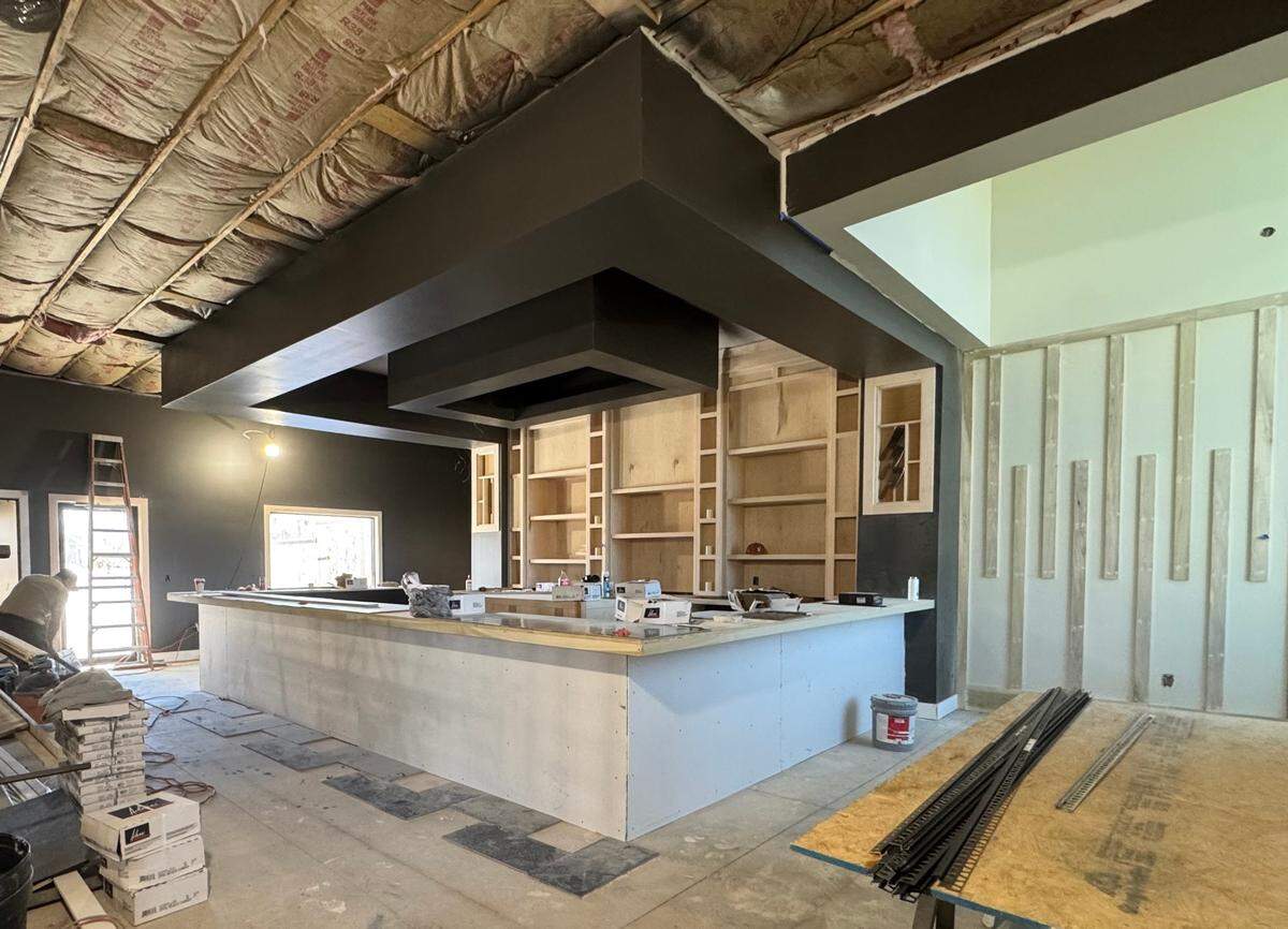 Pictured is the under-construction bar area of KVH Chophouse at 29th and Tyler in Wichita. To the right of the photo is the “wall of keys” that will sit behind a grand piano.