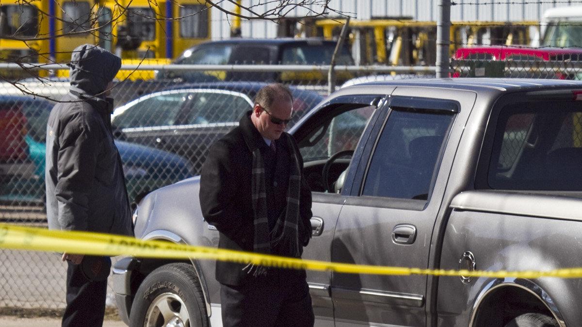 Wichita Police investigate the scene where an employee was found shot in the parking lot of Santana Concrete, 3665 W. McCormick. The man, in his 40s, was found about 7 a.m., still alive, in a vehicle at the business at 3665 W. McCormick, a few blocks east of West Street, police Lt. Doug Nolte said. He died about 7:52 a.m. after being taken to Via Christi Hospital St. Francis. (Feb.21, 2014)
