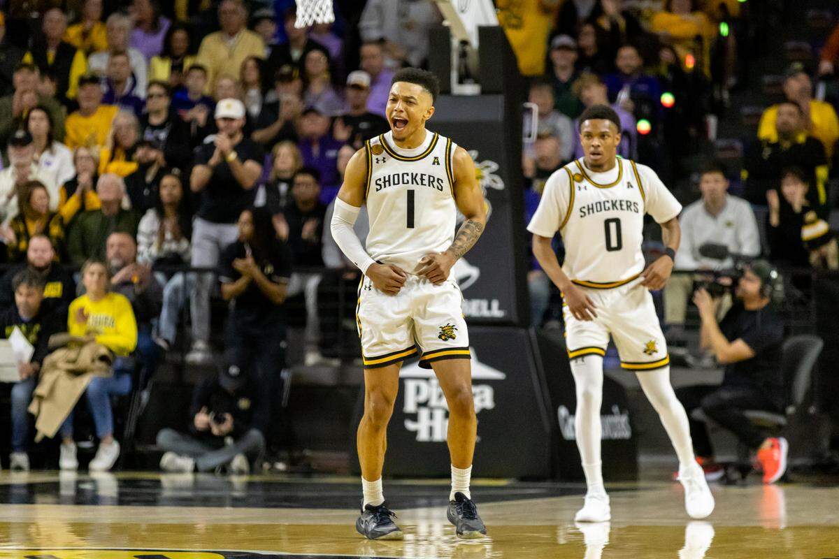 Xavier Bell celebrates after a basket score against Kansas State in the first half of Saturday’s game at Koch Arena.