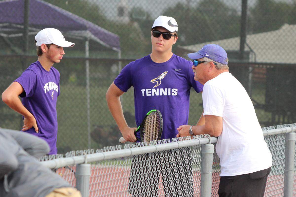 Valley Center tennis coach Dean Schulz talks with his players during the Class 5A tournament.