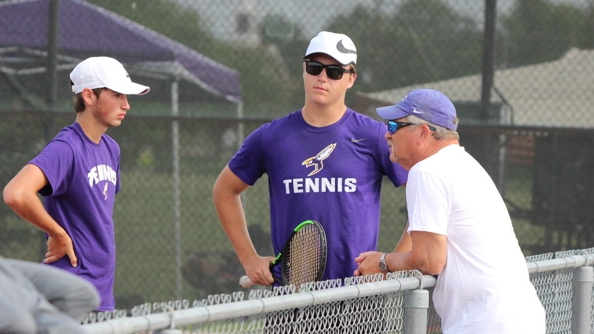Valley Center tennis coach Dean Schulz talks with his players during the Class 5A tournament.