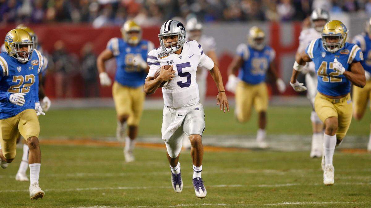 K-State quarterback Alex Delton sprints 68 yards for a touchdown at the end of the Cactus Bowl in December.