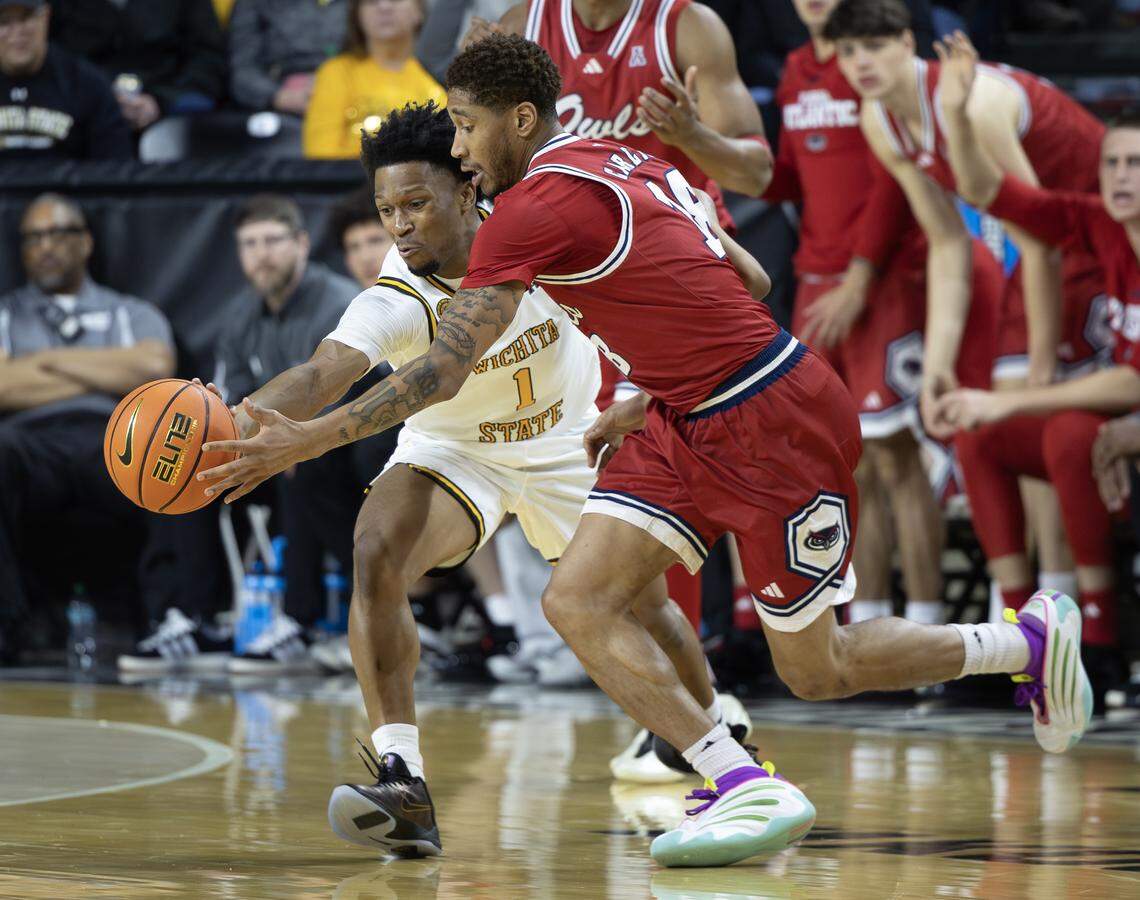 Wichita State’s Kenyon Giles steals the ball from Florida Atlantic’s Kanaan Carlyle during the second half on Saturday at Koch Arena.