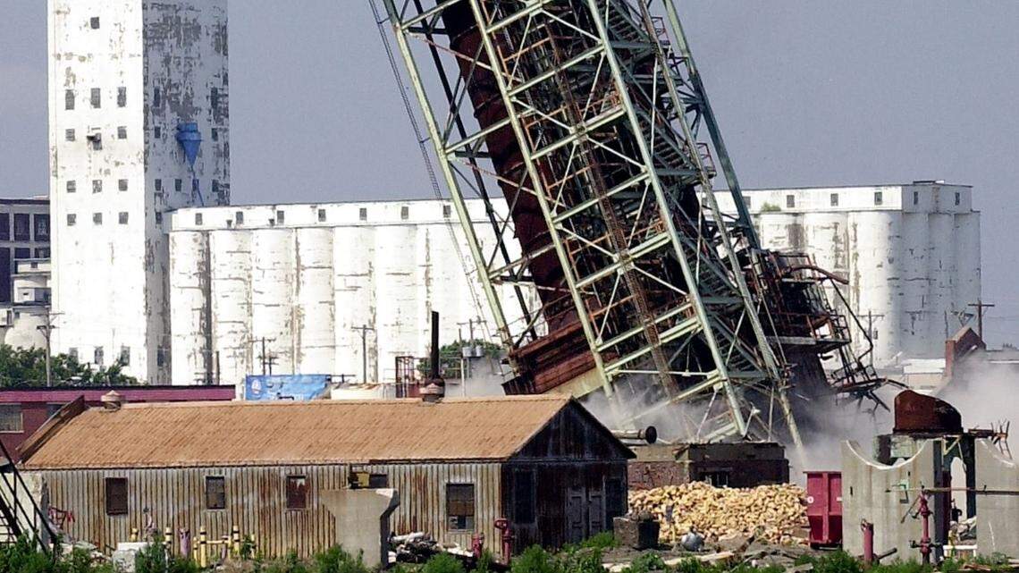 This file photo from 2005 shows the explosive demolition of a tower at the former Derby/El Paso refinery site. The site, now cleared, will be redeveloped with warehouses and manufacturing space.