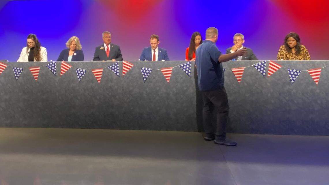 Candidates for Wichita mayor prepare for a debate that was broadcast on PBS Kansas July 20.
