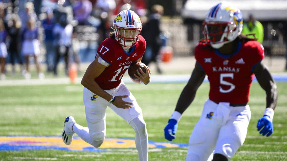 Kansas quarterback Jason Bean (17) carries against TCU during the second half of an NCAA college football game Saturday, Oct. 8, 2022, in Lawrence, Kan. (AP Photo/Reed Hoffmann)