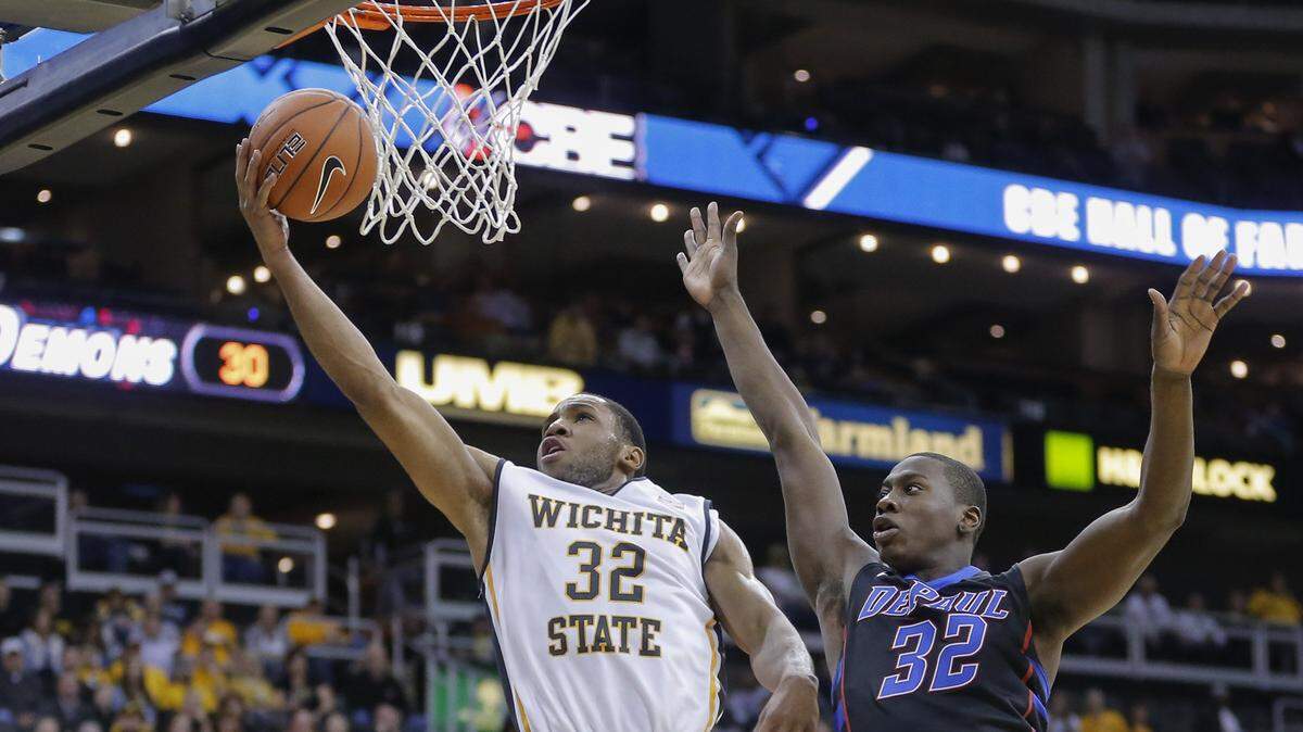 Wichita State’s Tekele Cotton scores against DePaul’s Charles McKinney during the first half of their CBE Hall of Fame Classic game at the Sprint Center in Kansas City in 2013.