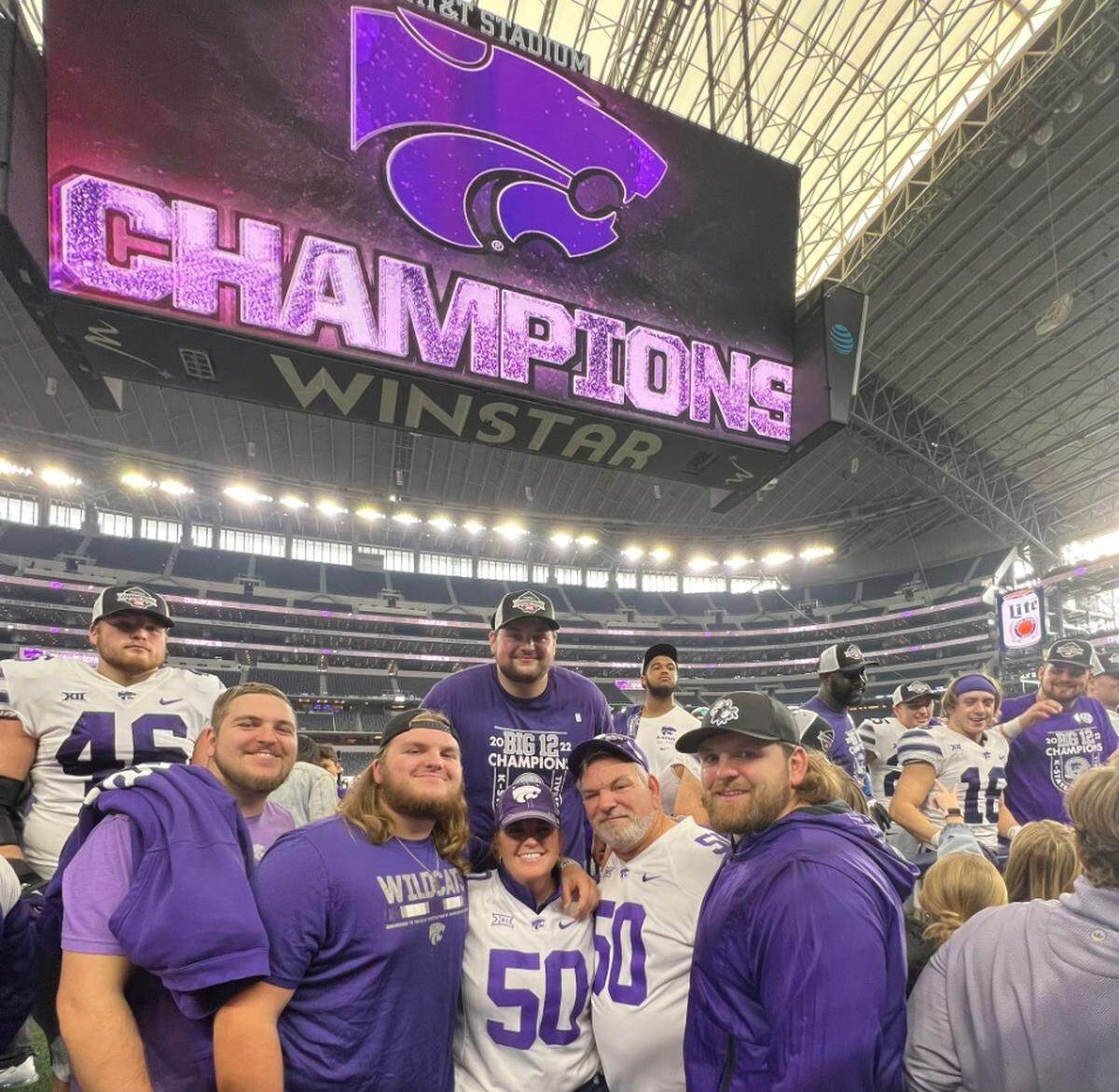Cooper Beebe celebrates with teammates and family after Kansas State beat TCU at the Big 12 championship game in Arlington, Texas.