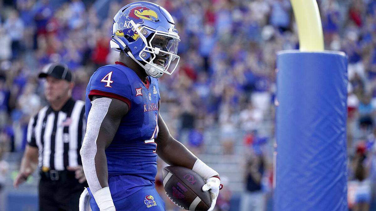 Kansas running back Devin Neal celebrates after scoring a touchdown during the first half of an NCAA college football game against Tennessee Tech Friday, Sept. 2, 2022, in Lawrence, Kan. (AP Photo/Charlie Riedel)