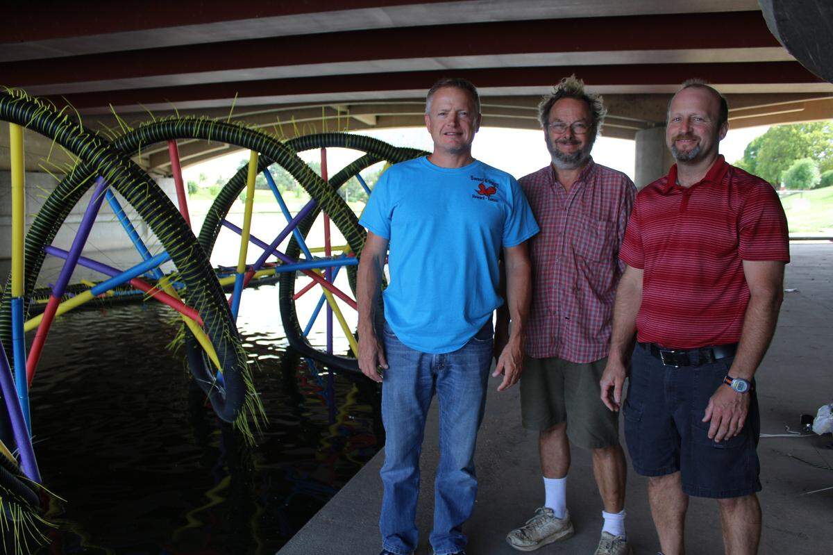 Ty Tabing, left, helped lead the 2017 project that resulted in a DNA-shaped sculpture floating on the Arkansas River.
