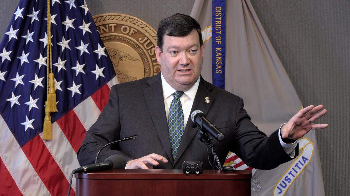 Then-United States Attorney Stephen McAllister in 2018 describes a federal indictment that was unsealed naming three men in a swatting incident.