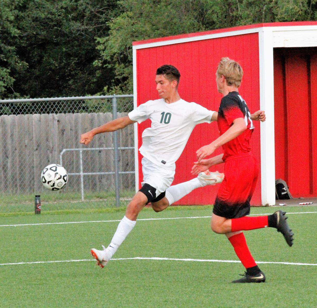 Carroll junior left wing Christian Barragan revs up to fire off the volley during the Golden Eagles’ 3-0 win at Maize on Tuesday. (Aug. 28, 2018)