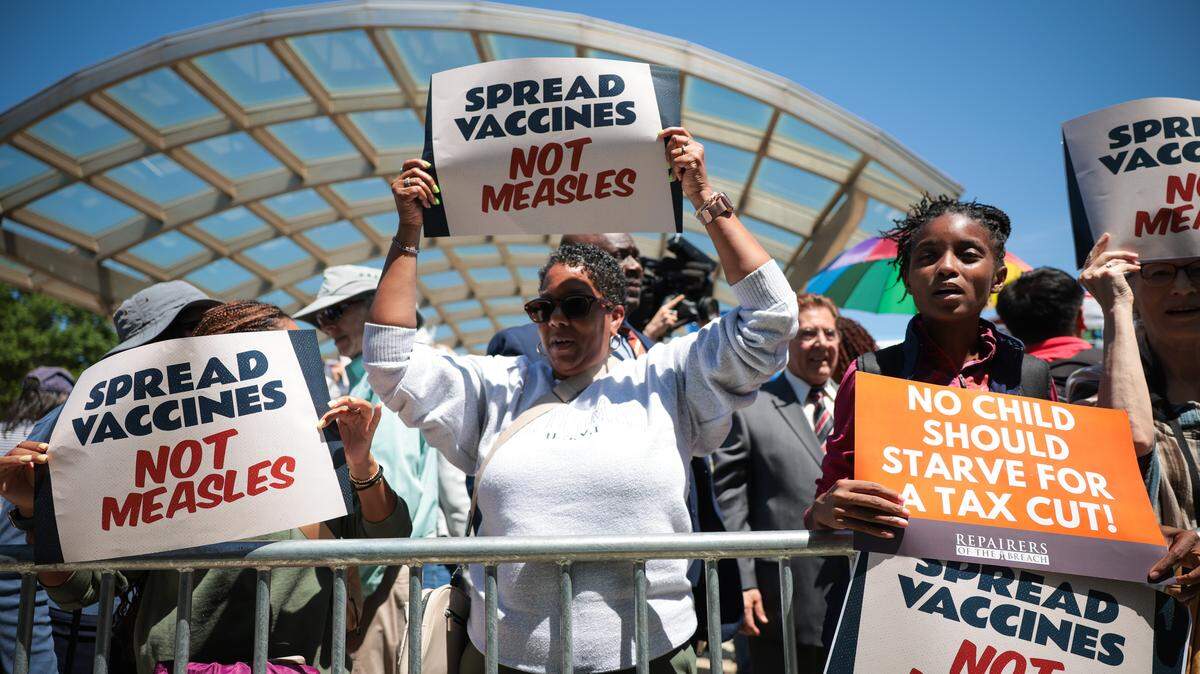 BETHESDA, MARYLAND - MAY 10: Demonstrators raise signs during Sen. Angela Alsobrooks (D-MD) "Sick Of It" rally against the Trump administration's health care policies in front of the National Institutes of Health (NIH) on May 10, 2025 in Bethesda, Maryland. Alsobrooks addressed U.S. Secretary of Health and Human Services Robert F. Kennedy, Jr.'s "Make America Healthy Again" movement. (Photo by Kayla Bartkowski/Getty Images)