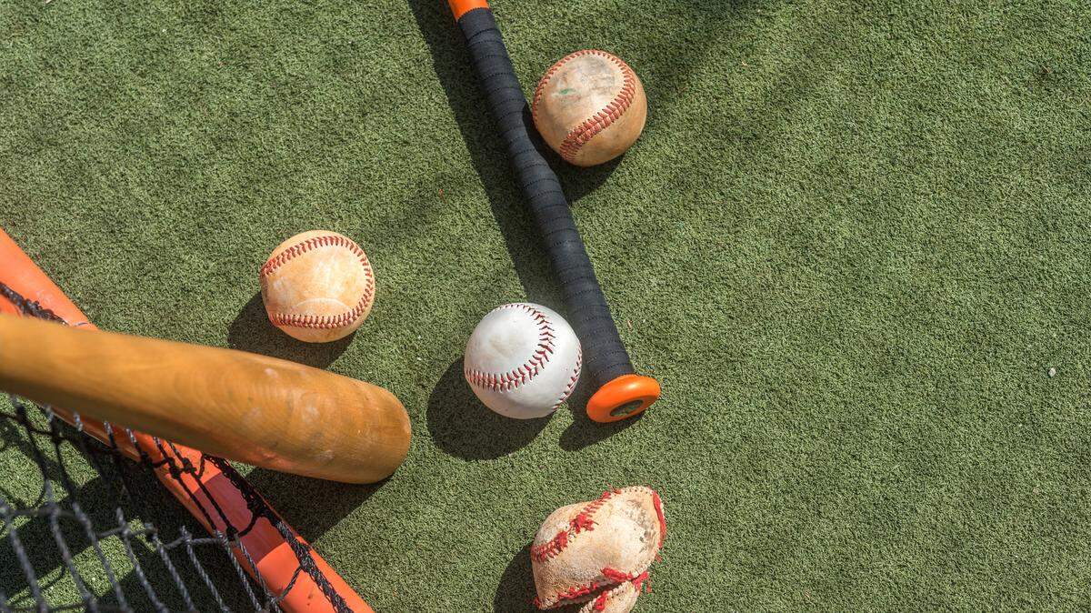 Crushed ball inside a batting cage practice.