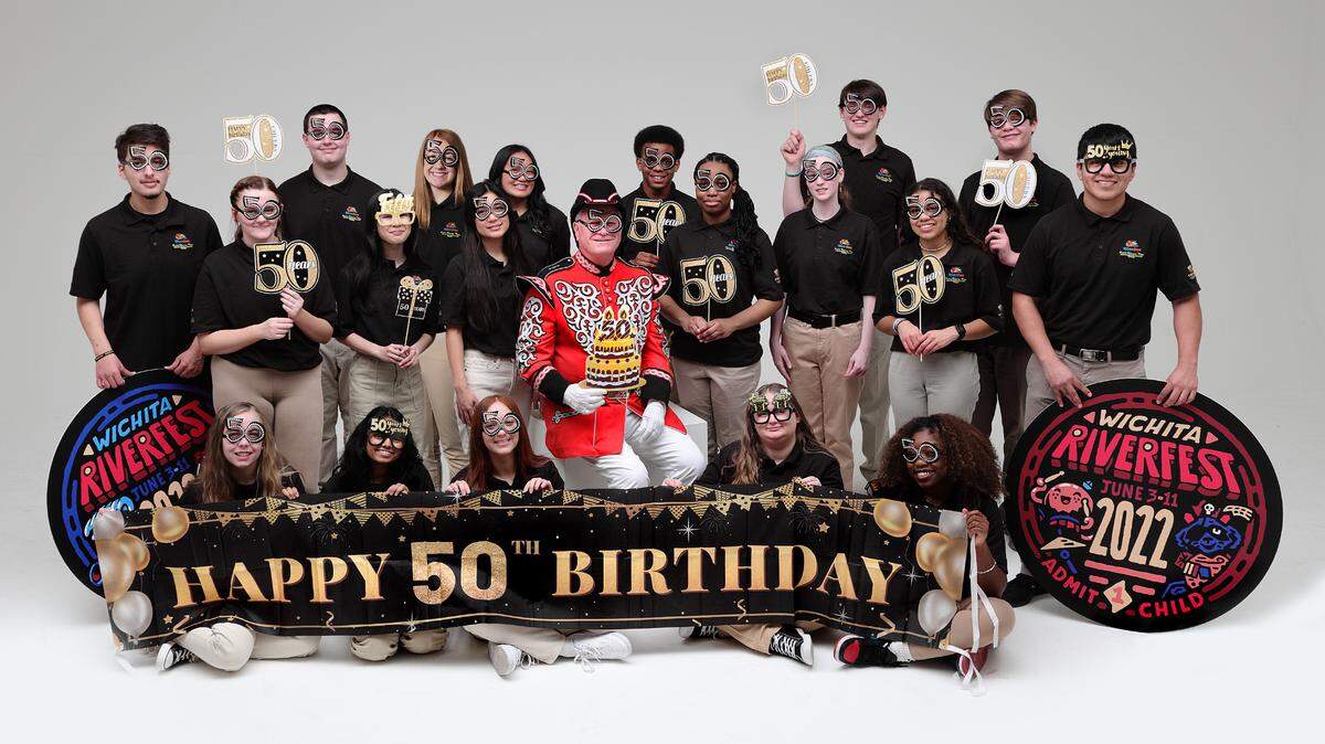 Local businessman Barry Schwan will serve as the Wichita Riverfest’s 48th Admiral Windwangon Smith. he’s pictured here with the Prairie Schooner Mates, a group of local high school juniors who will also serve as festival ambassadors.