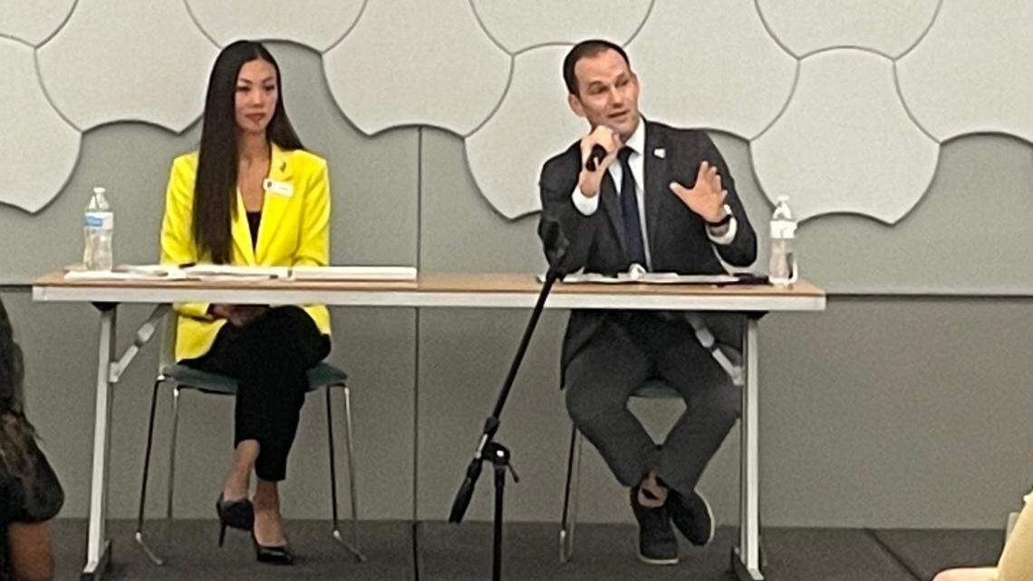Mayoral challenger Lily Wu and incumbent Brandon Whipple on stage at a forum on affordable housing at the Advanced Learning Library on Oct. 11.