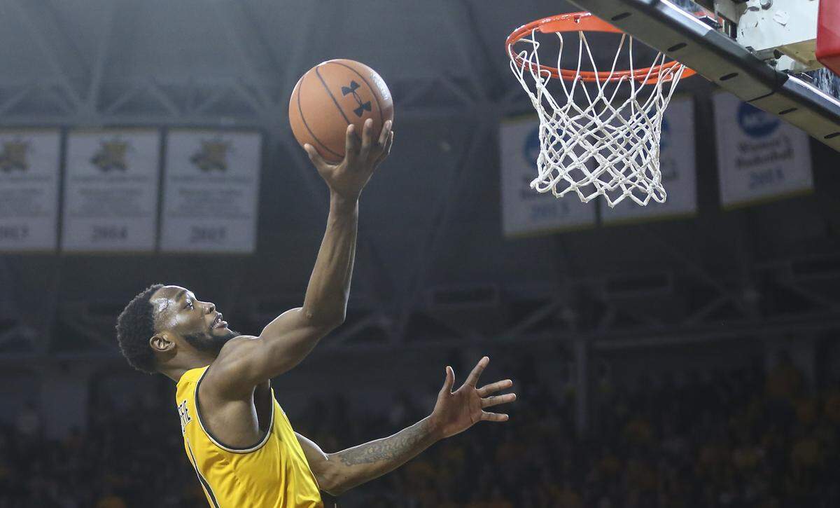 Wichita State forward Markis McDuffie makes a shot after getting an offensive rebound during the second half against Tulsa at Koch Arena on Saturday.