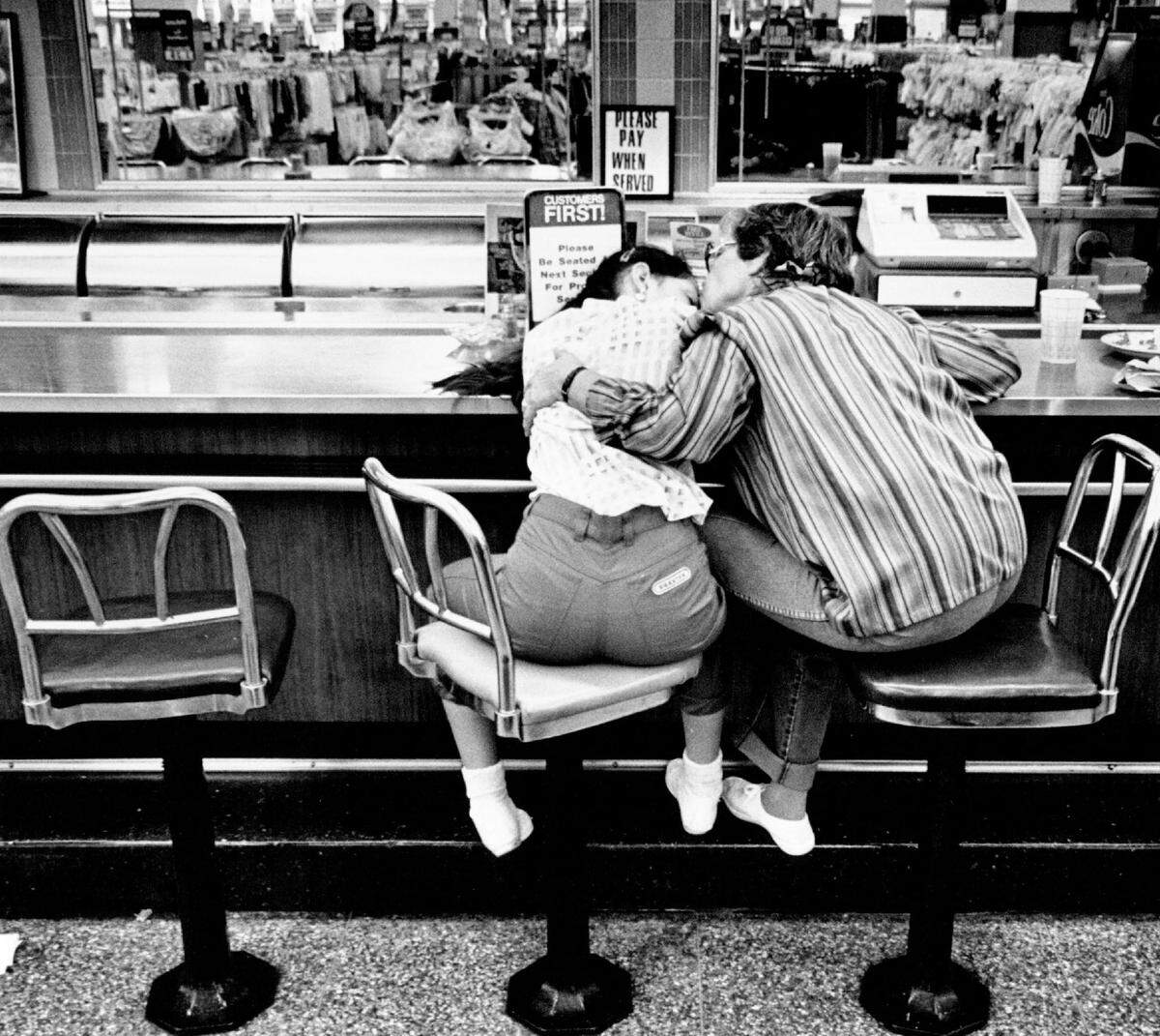 A little girl and her grandma at the Woolworth lunch counter just before the store closed in early 1991..