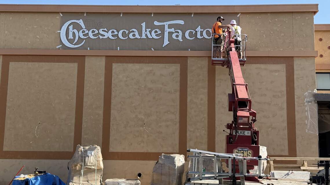 A good sign: Cheesecake Factory’s marquee goes up, and its opening is weeks away.