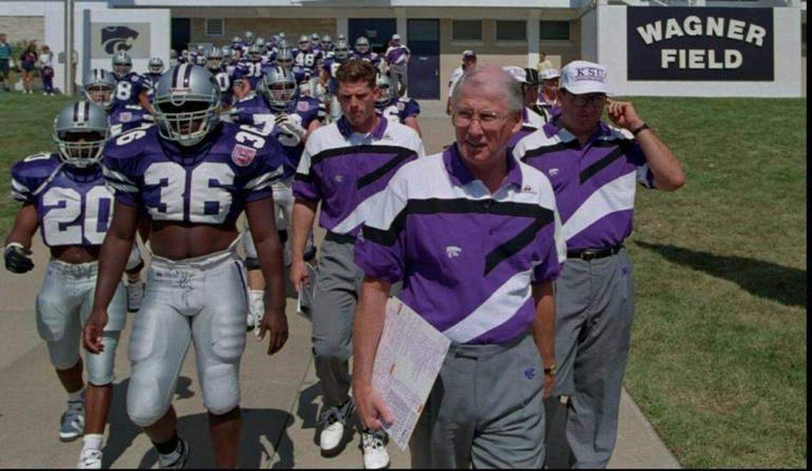 Bill Snyder leads the Kansas State Wildcats onto the football field before a game in 1994.