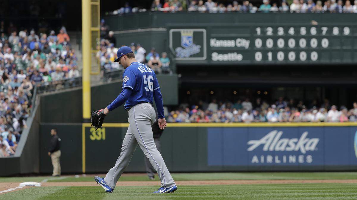 Kansas City Royals starting pitcher Brad Keller walks off the field after throwing against the Seattle Mariners during the seventh inning Sunday in Seattle.