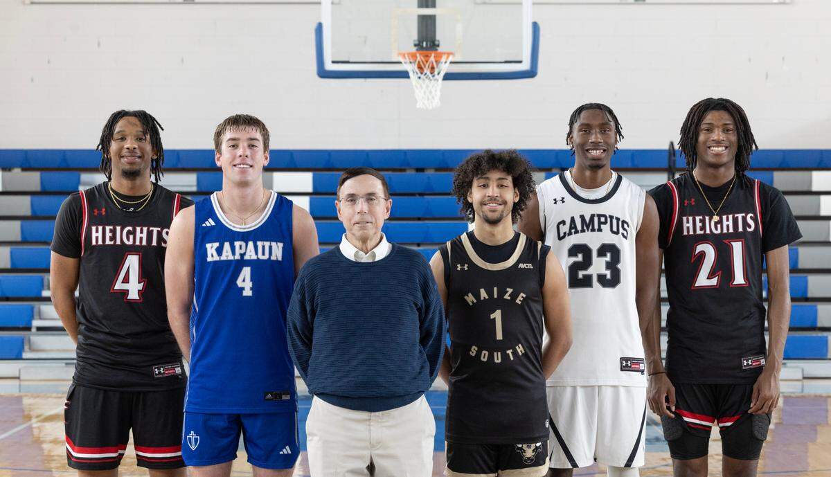 The 2024 Wichita Eagle All-Metro boys basketball team. From left to right: Heights’ TJ Williams, Kapaun’s Will Thengvall, Kapaun coach Steve Eck, Maize South’s Michael Kates, Campus’ Andrell Burton Jr. and Heights’ Amalachi Wilkins. Not pictured: Maize South’s Tory Homan.