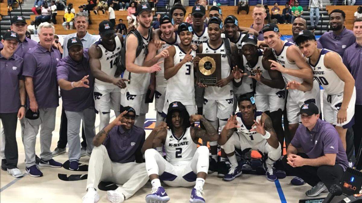 K-State players celebrate a Paradise Jam championship.