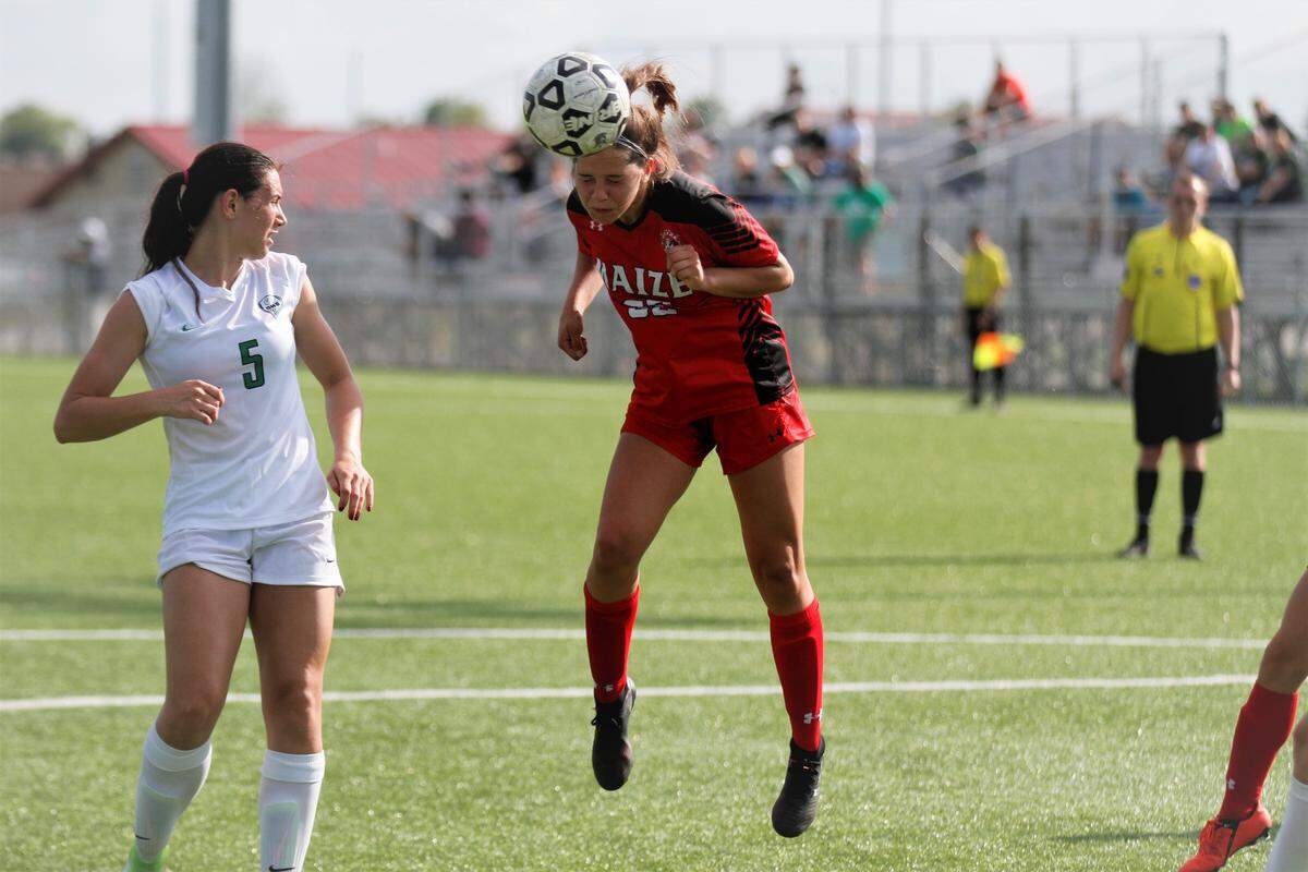 Derby’s Sydney Nilles and Maize’s Kaylee Wilcox