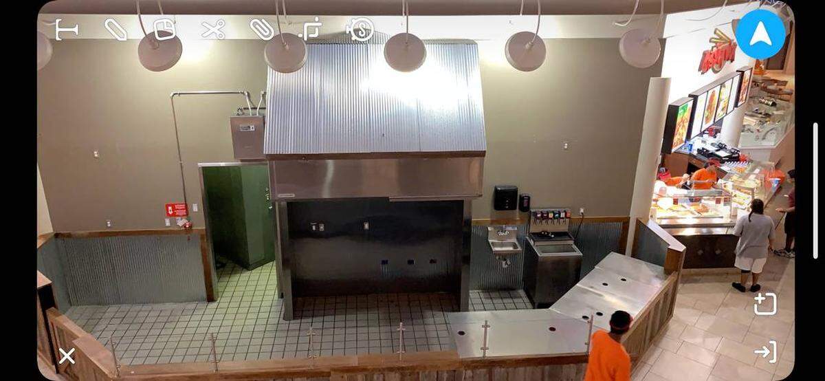 The space at Towne East Square’s food court most recently filled Athens is about to get a new tenant: BurgDogs.