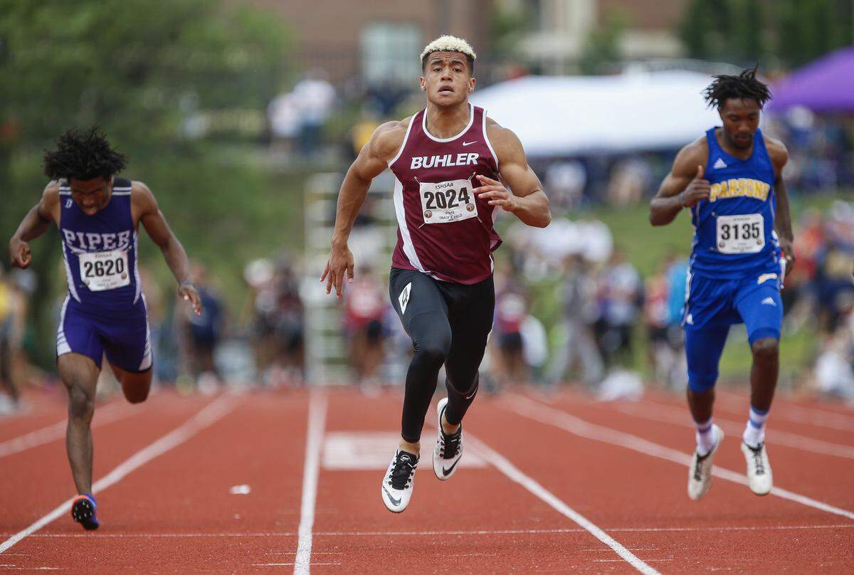 Buhler’s Jordan Hawkins, center, wins the 4A 100 meter dash with a time of 10.65 at the Track and Field State Championships at Cessna Stadium Saturday. (May 25, 2019)